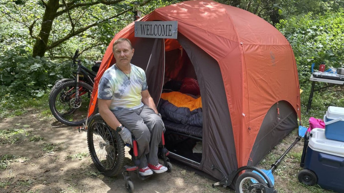 bob-vogel-in-front-of-tent-and-camping-cot1.jpeg