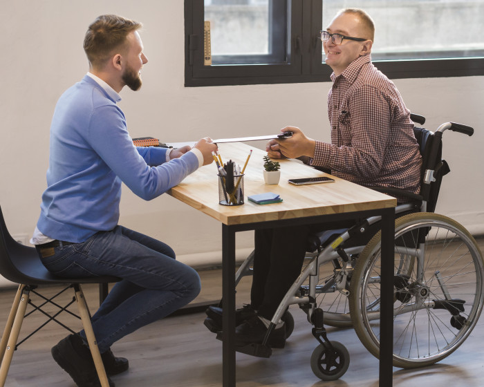 manager-working-together-with-disabled-worker.jpg